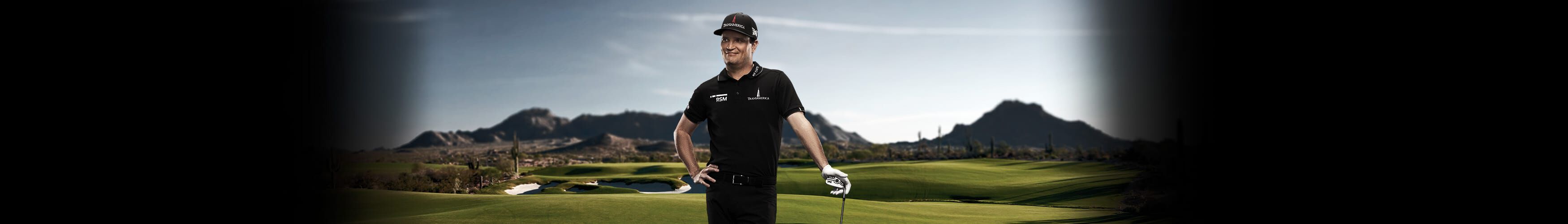 Golfer on course with PXG hat