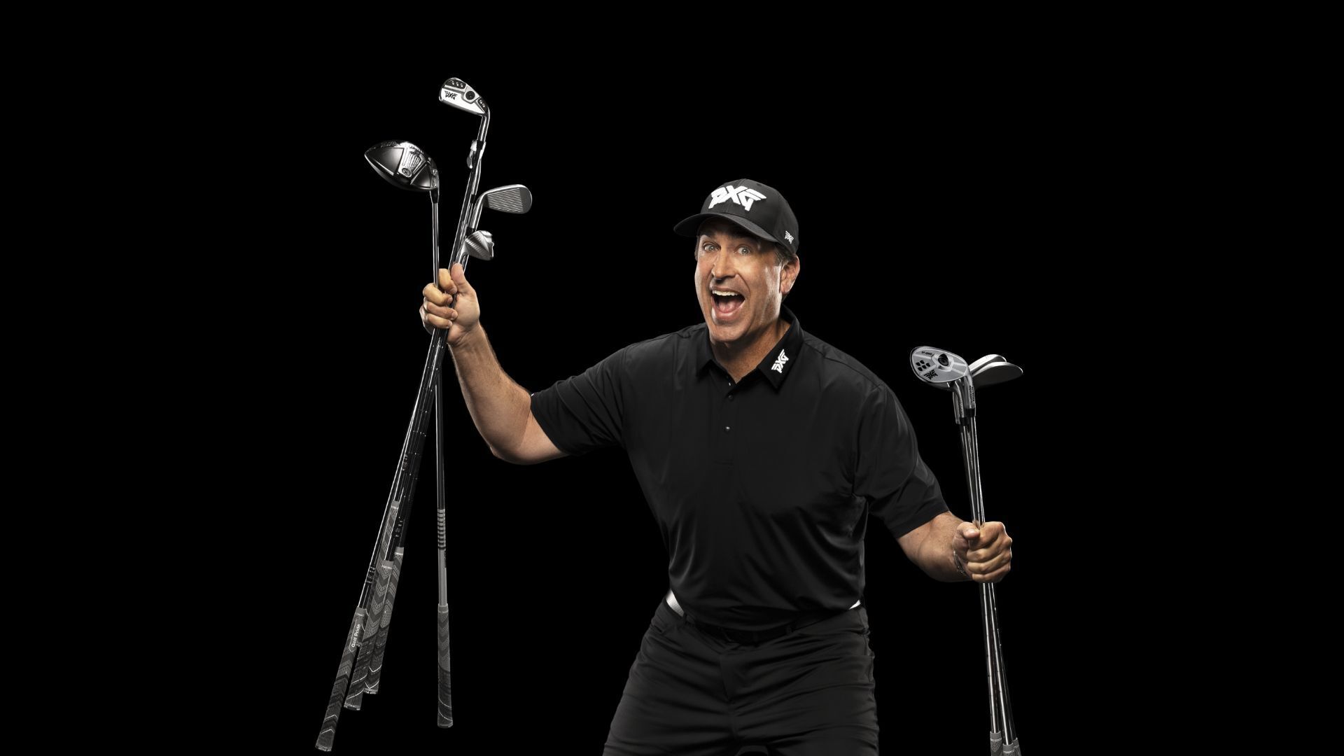 Rob Riggle holding pxg golf clubs
