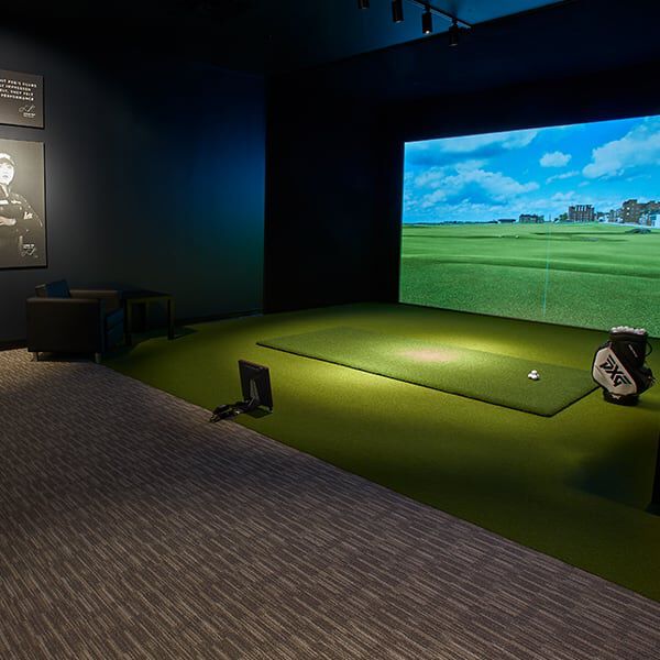 PXG Detroit Interior with a fitting bay and a wall of golf shafts.