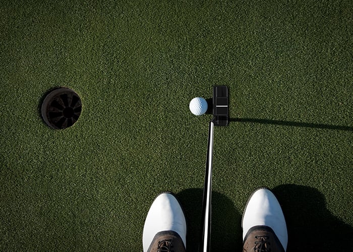 Golfer with putter